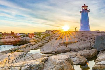 A sunset view of the lighthouse of the famous Peggy's Cove in Nova Scotia.