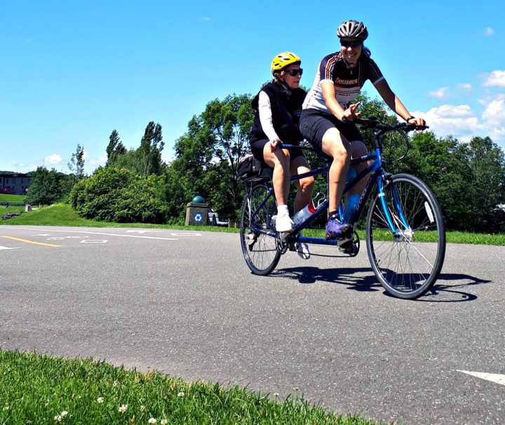 Cycling on a tandem bike on quiet roads and bike paths along the Navigator’s Route - the south shore of the Saint Lawrence River with Freewheeling Adventures