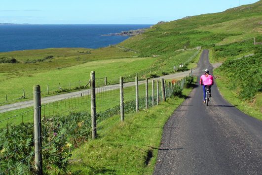Travel by bike with Freewheeling Adventures along quiet, single-track roads with varying terrain along the glens, lochs, rivers, seashores, and across wide open moors of western Scotland.