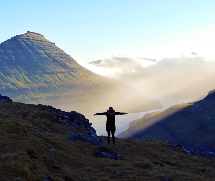 The Faroe Islands lie about halfway between Scotland and Iceland in the Atlantic Ocean. Consisting of 18 main islands and hundreds more islets and skerries, the rugged, rocky Faroes are best known for their bird cliffs and unspoiled landscapes.