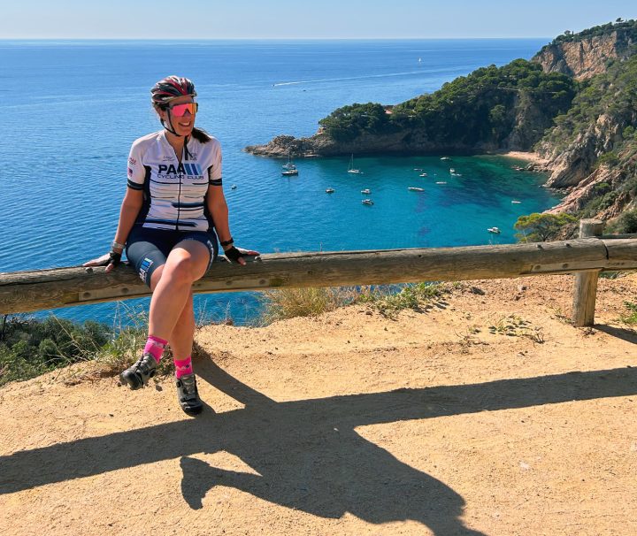 The extremely well kept road cruises along the coastal cliffs above the shockingly turquoise water between Barcelona and Catalonia on a Freewheeling Adventure cycling tour.