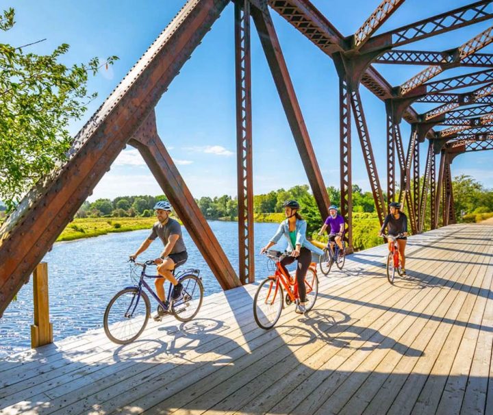 This image shows cyclists on the Harvest Moon Trailway, a popular multi-use trail in Nova Scotia