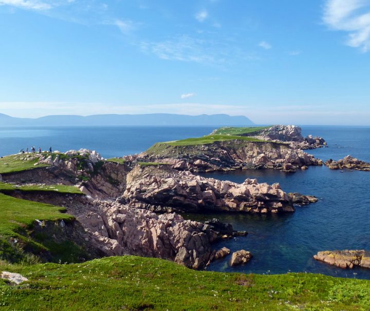 This image shows a scenic view of the coastal cliffs at White Point on Cape Breton Island, Nova Scotia
