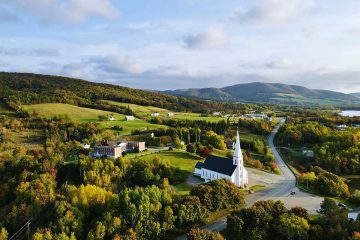This image captures the village of Mabou in Cape Breton, Nova Scotia, surrounded by autumn foliage