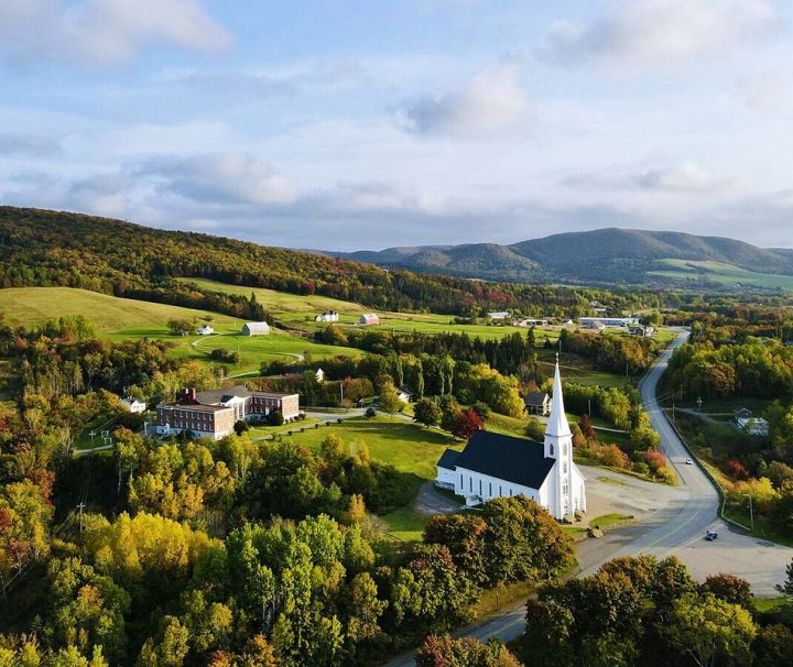 This image captures the village of Mabou in Cape Breton, Nova Scotia, surrounded by autumn foliage
