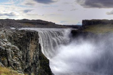 This image shows Dettifoss, a massive waterfall located in Vatnajökull National Park in Northeast Iceland