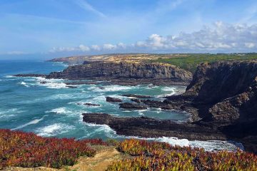 A scenic view of Cabo Sardão (Cape Sardao) in Portugal, a prominent headland located within the Southwest Alentejo and Vicentine Coast Natural Park