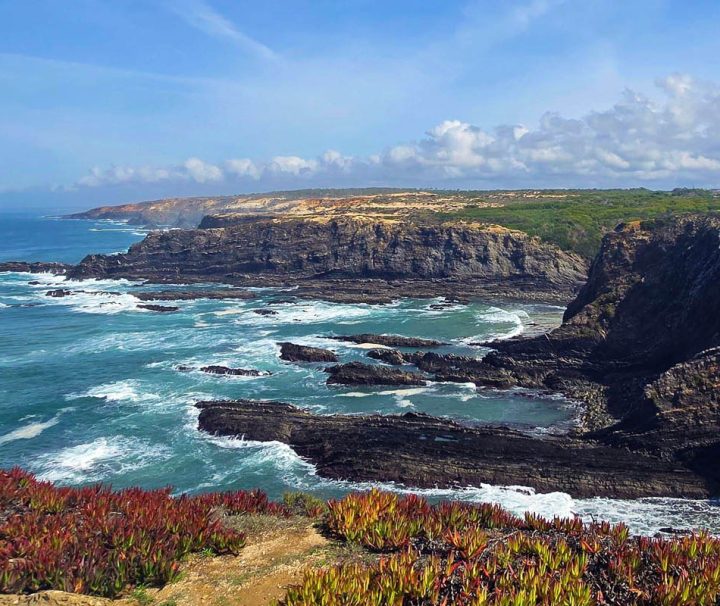 A scenic view of Cabo Sardão (Cape Sardao) in Portugal, a prominent headland located within the Southwest Alentejo and Vicentine Coast Natural Park
