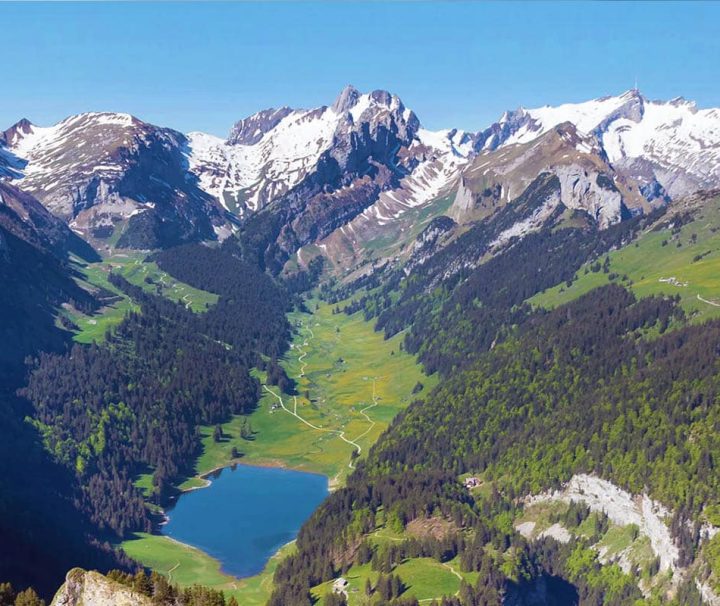 The stunning Seealpsee lake located in the Alpstein mountain range of Switzerland