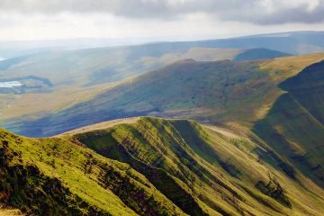 This image shows a view from the summit of Pen y Fan in the Bannau Brycheiniog (Brecon Beacons) National Park in Wales