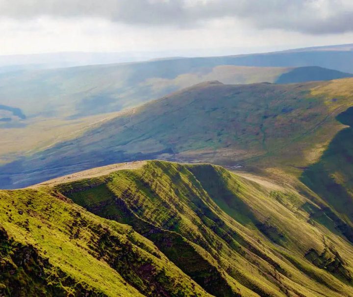 This image shows a view from the summit of Pen y Fan in the Bannau Brycheiniog (Brecon Beacons) National Park in Wales